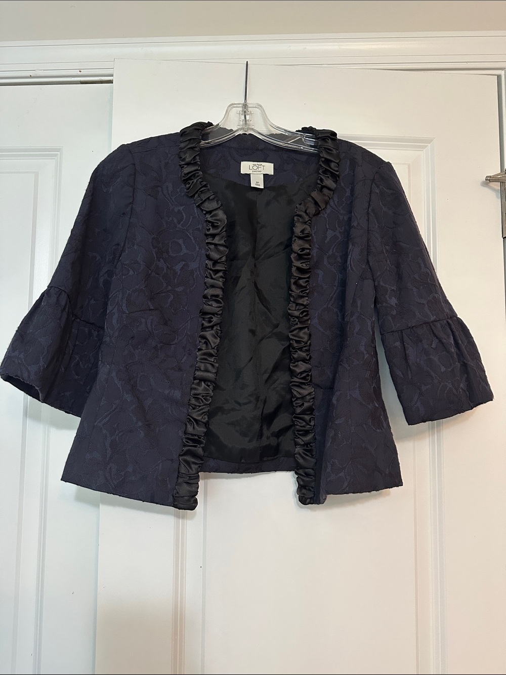 Loft size 8p Navy 3/4 sleeve jacquard ribbon blazer with a black ruffle trim.